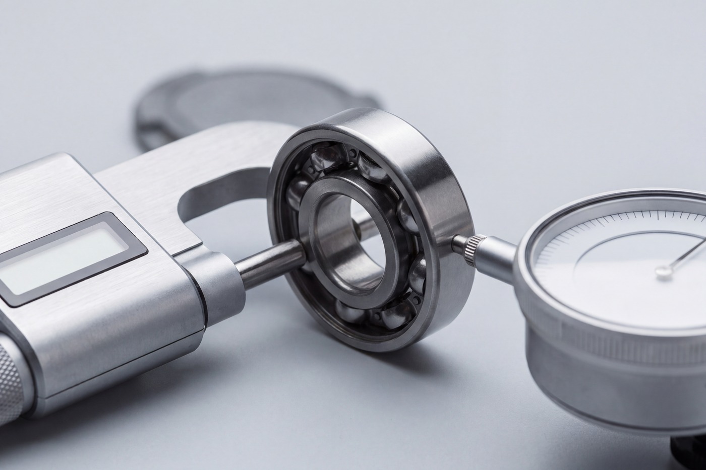 Dimensional inspection of a bearing with a micrometer and dial indicator